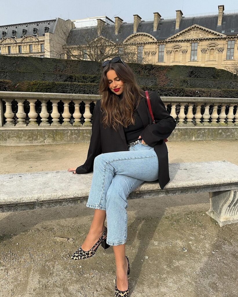 Chic fall outfit with black blazer, light blue jeans, and leopard print heels