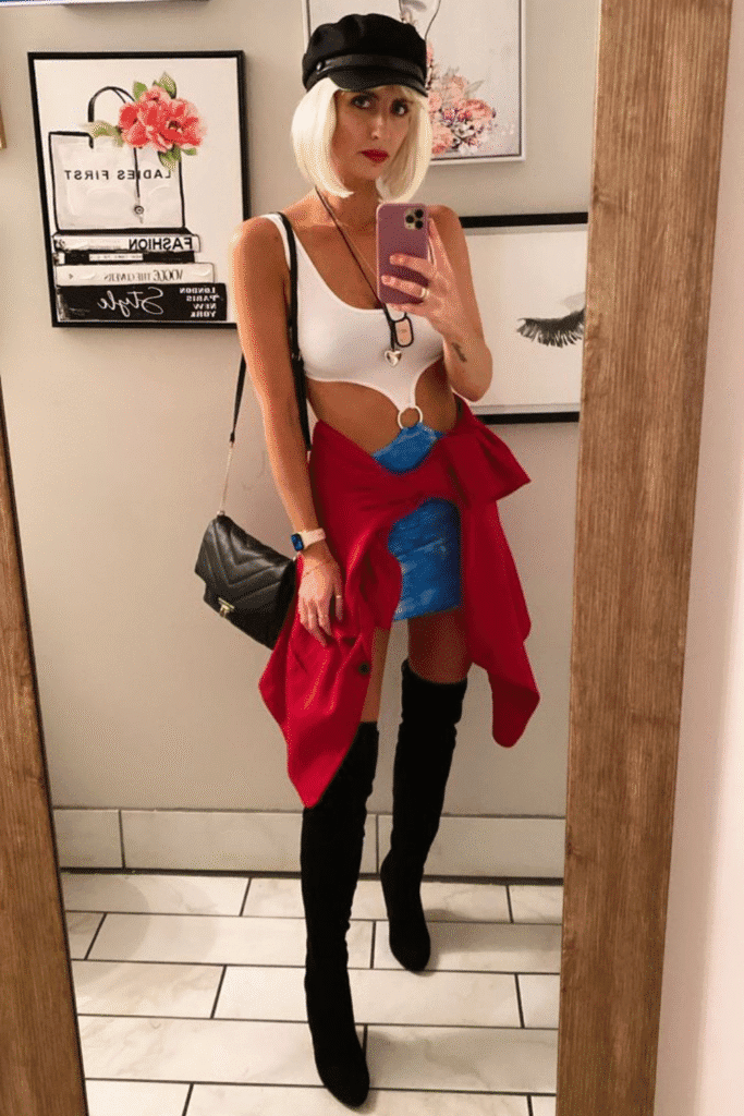 Pretty Woman Halloween costume with white cutout dress, blue skirt, black boots, and cap—a playful Julia Roberts look for Halloween.