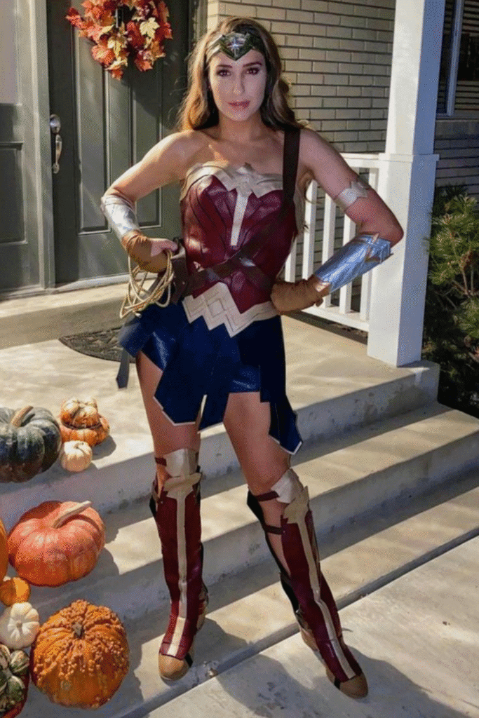 Wonder Woman Halloween costume with red corset, navy skirt, and gold accessories—a fierce superhero party look.
