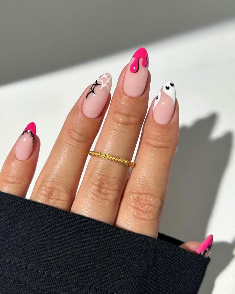 Hot pink and black Halloween nails with drips, spiderweb, and ghost art on almond shape.
