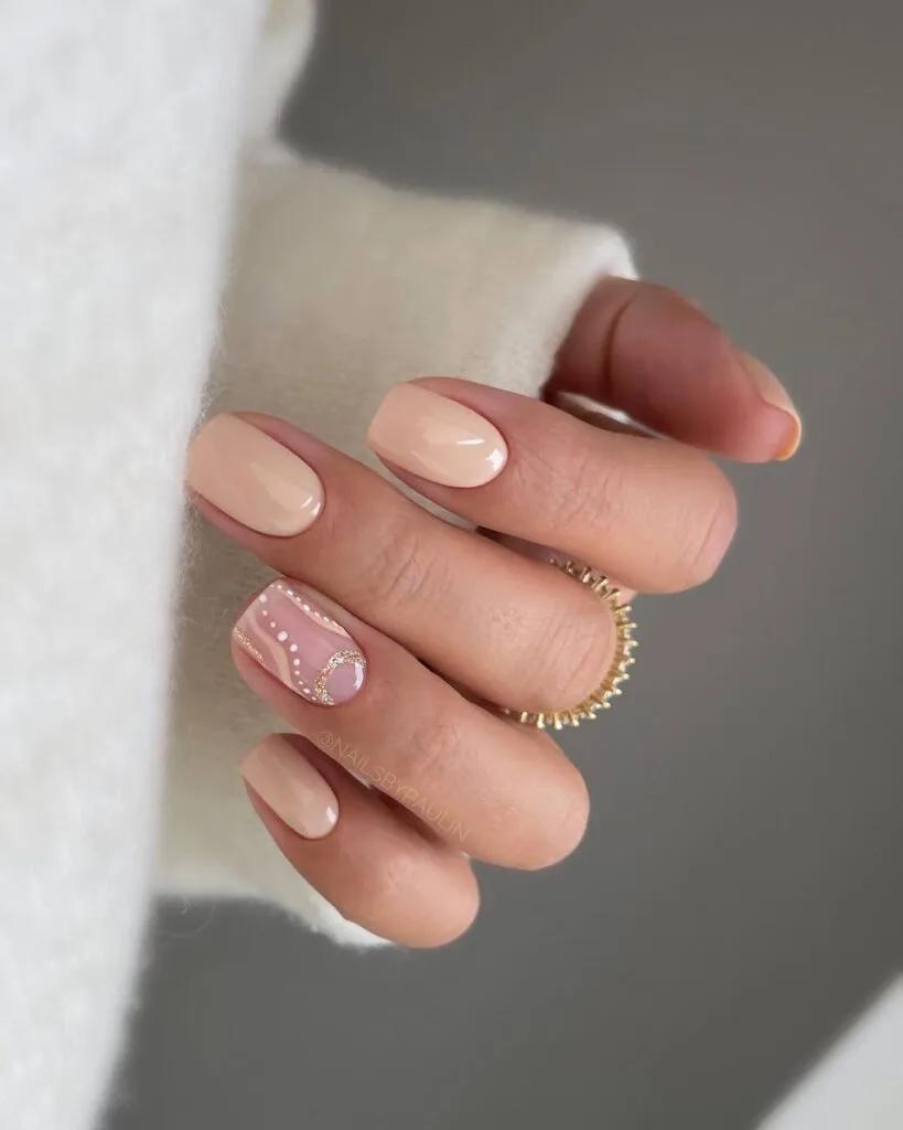 Nude neutral nails, short square shape with gold details and dot accent, minimalist and trendy.