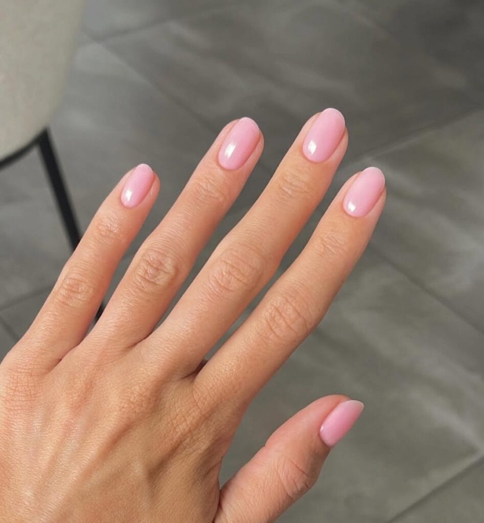 Light pink old money nails, rounded and glossy, natural look with subtle sheen.