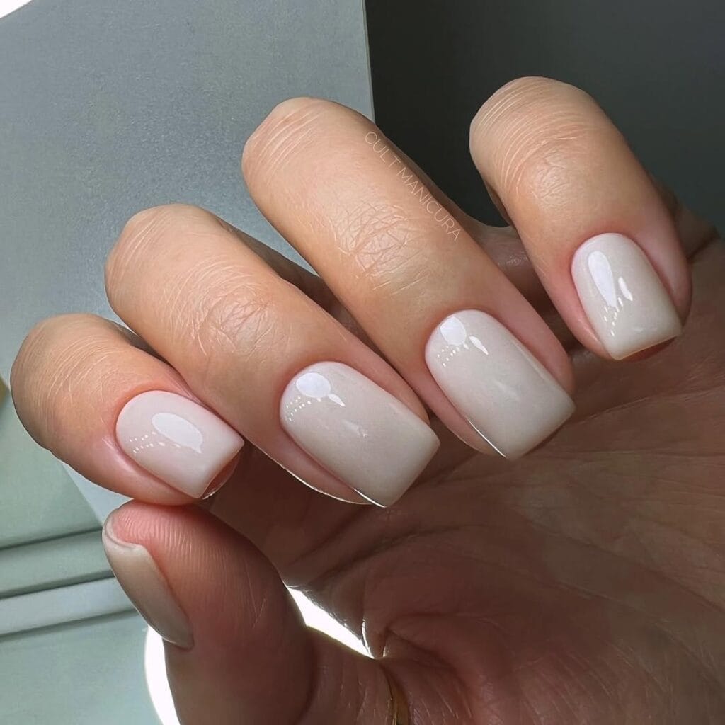 Creamy nude square nails, porcelain neutral shade, high gloss and minimal look.
