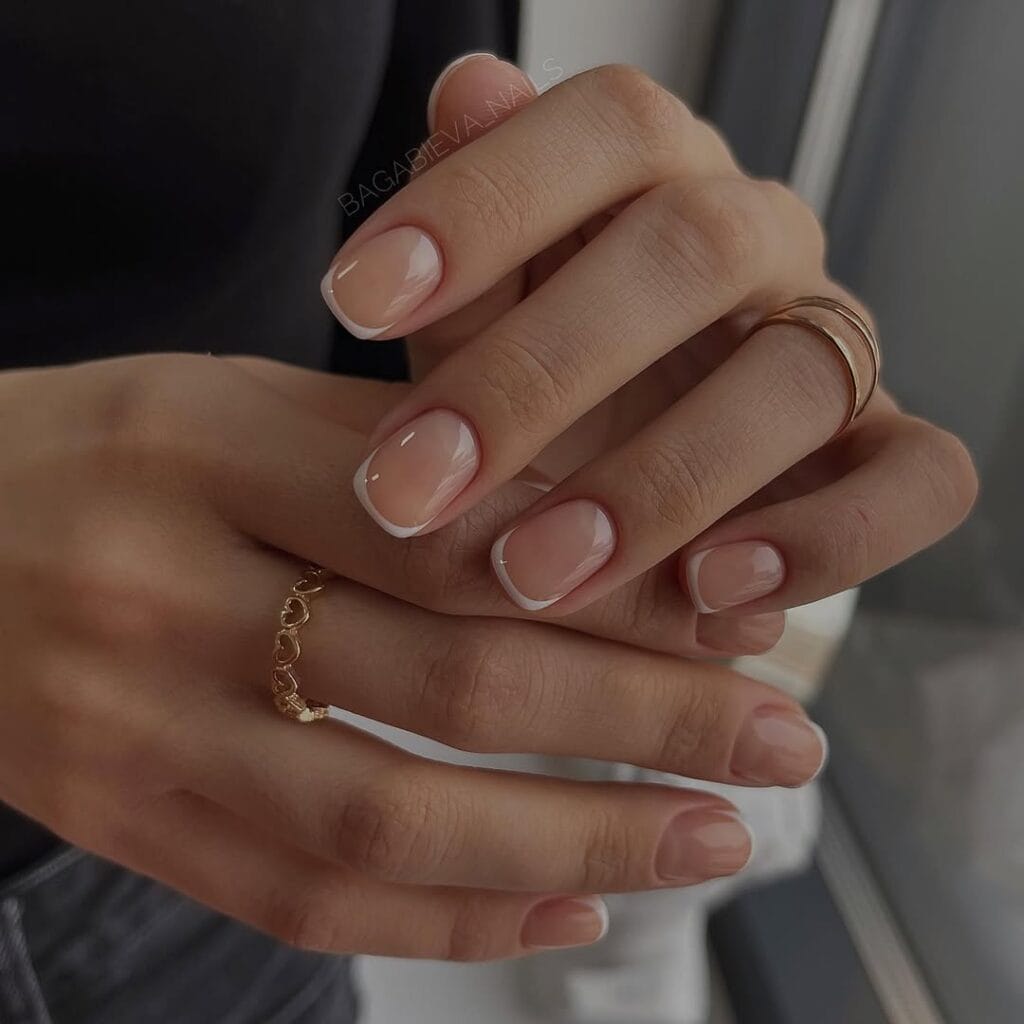 Classic French old money nails with thin white tips on nude base, clean and timeless, minimal luxury.
